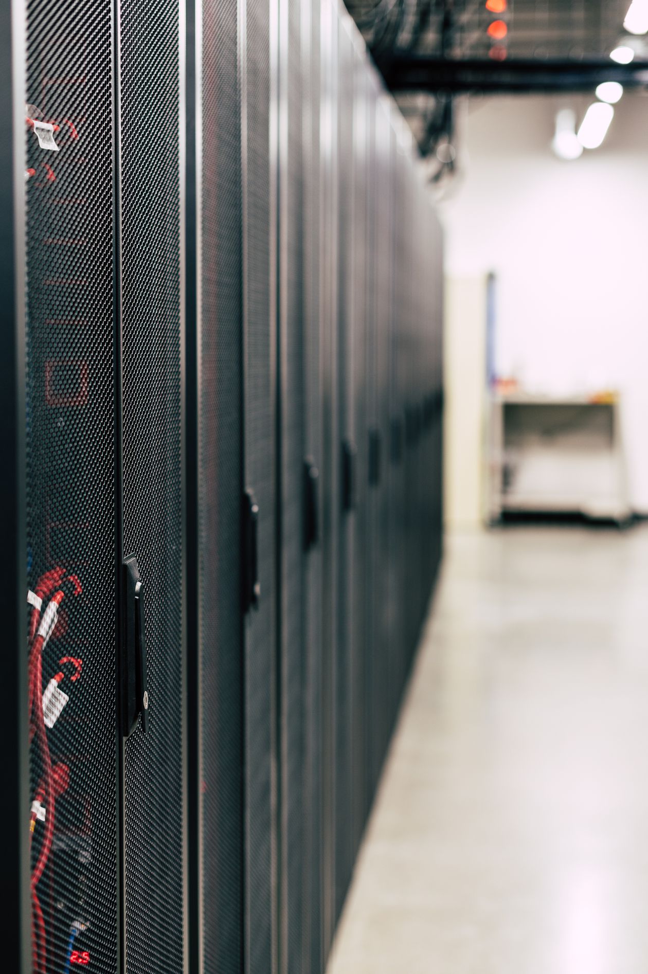 Server racks representing developer infrastructure targeted by the ChainDrop npm supply-chain attack