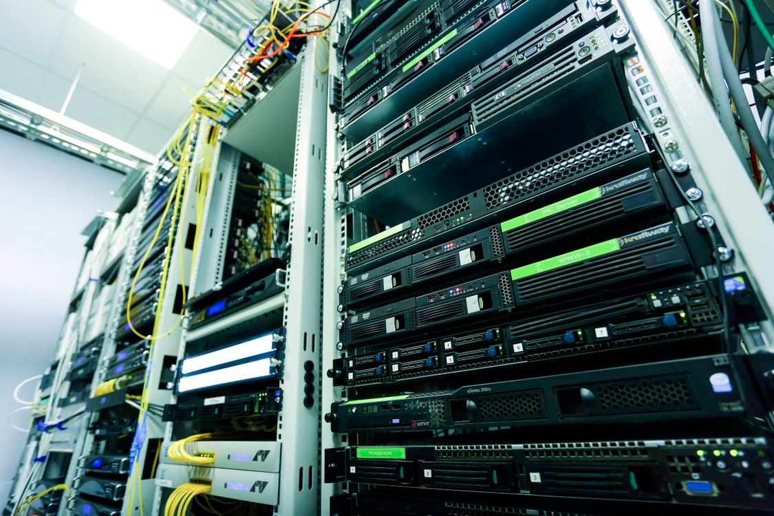 SAP Commerce Cloud cybersecurity risk represented by network servers and cables in a secure data center
