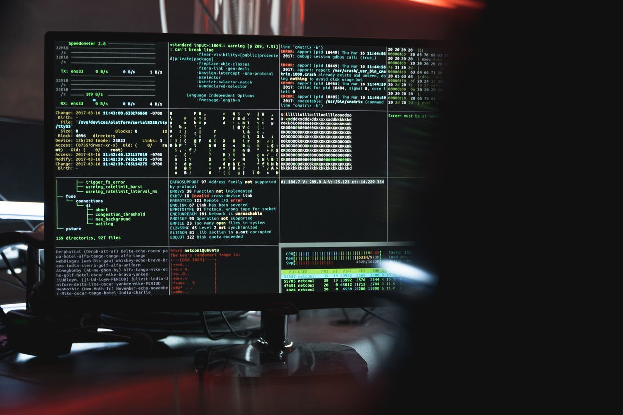 Cybersecurity monitor displaying code during ransomware threat analysis