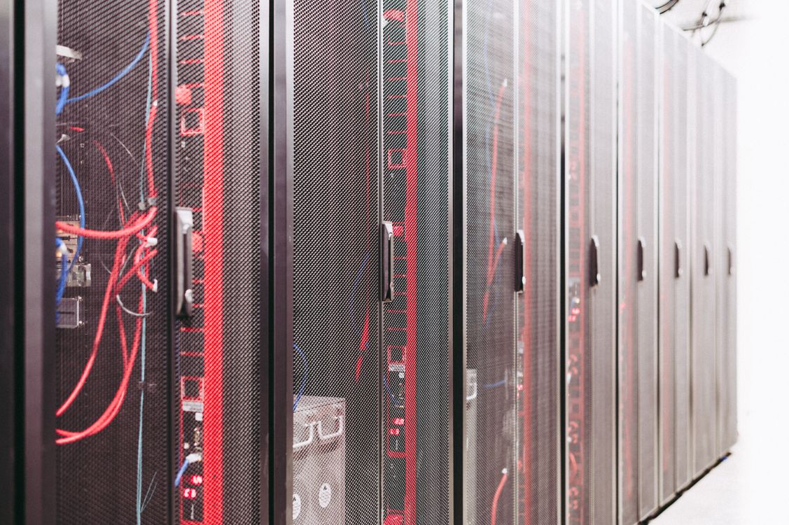 VMware vCenter cybersecurity risk represented by network racks and cables in a modern data center